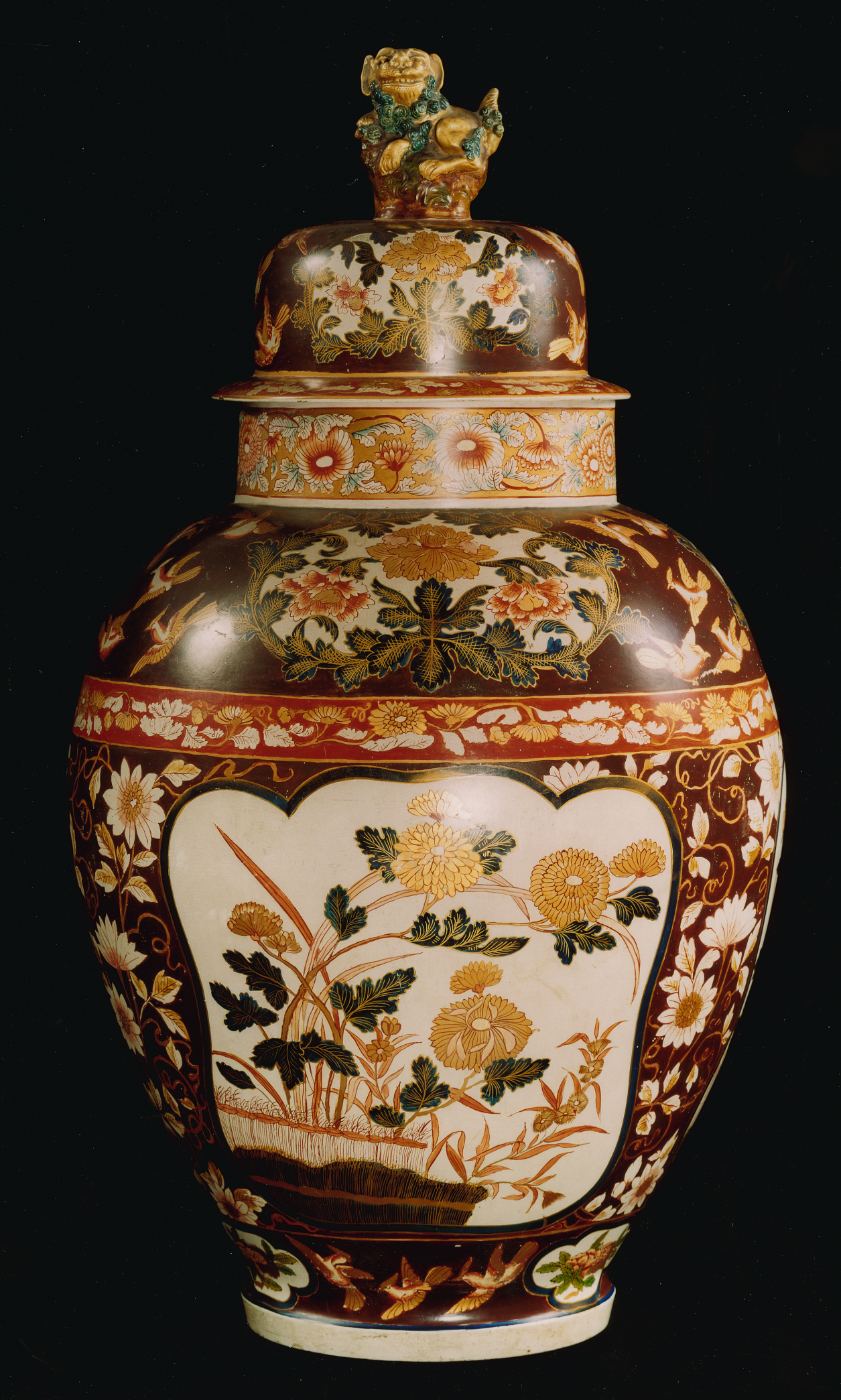 A guarniture of three large Imari-style painted terracotta vases